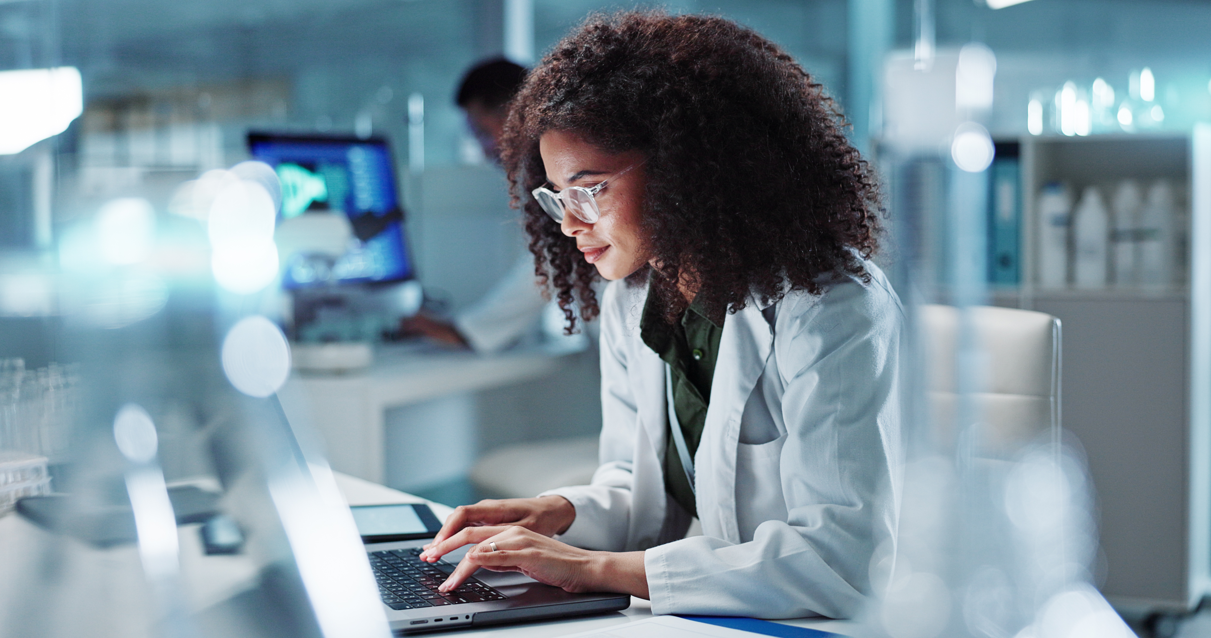 A focused researcher working at a laptop